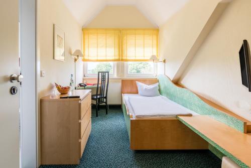 Una cama o camas en una habitación de Andante Hotel Dresden