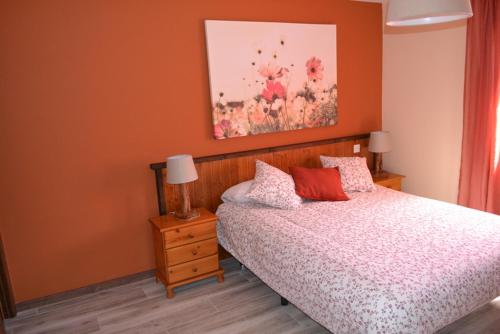 A bed or beds in a room at La Casita Del Abuelo