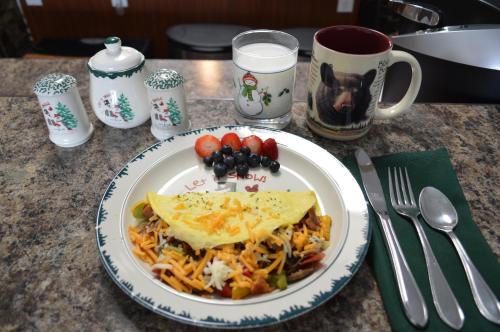 a plate of food on a table with a plate of food at The Bear's Den B&B in Page