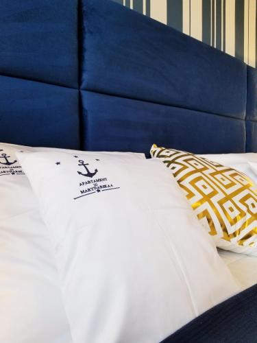 Postel nebo postele na pokoji v ubytování Apartamenty Marynarskie 100m od plaży