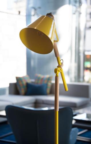 a yellow lamp sitting on top of a table at Casa Grande Express in La Paz