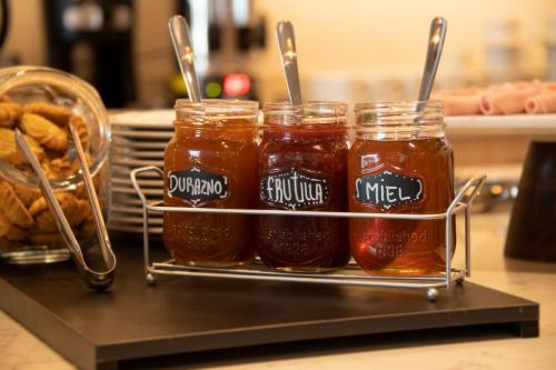 a rack of jars of honey on a counter at Casa Grande Express in La Paz