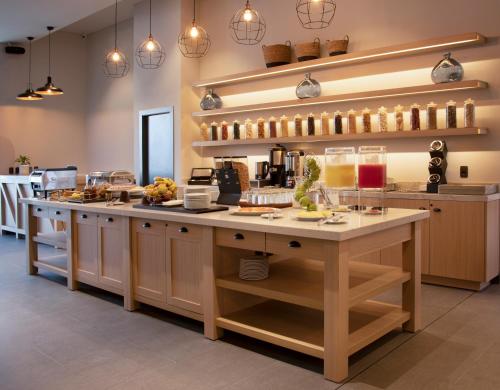 a kitchen with a large island in the middle at Casa Grande Express in La Paz