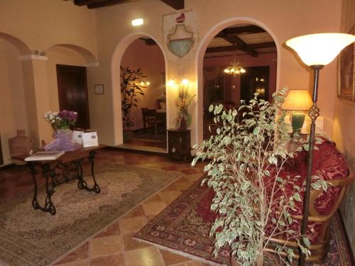 a living room with a couch and a table at Villa Dei Dogi in Caorle