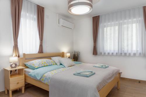 Katil atau katil-katil dalam bilik di Holiday home, Apartman Obajdin