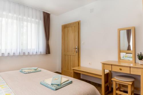 Katil atau katil-katil dalam bilik di Holiday home, Apartman Obajdin