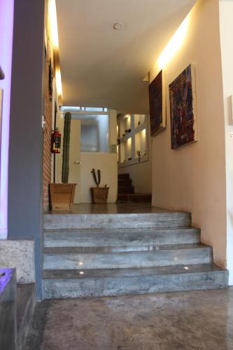 a set of stairs in a room with at Carcamanes 17 Gastro-Hotel in Guanajuato