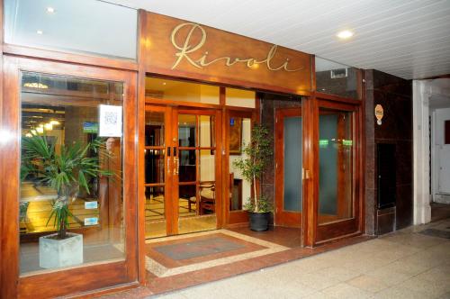 
a room with a large window and a large door at Hotel Rivoli in Mar del Plata
