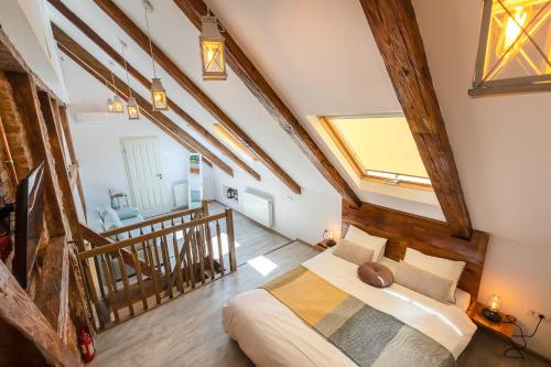 a bedroom with a large bed in a attic at Casa Carolina Brasov in Braşov
