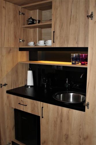 a kitchen with a sink and a counter at Dali Rooms in Chania