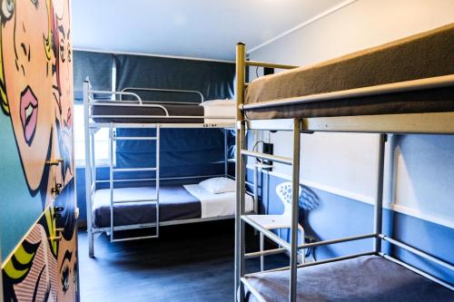 Двухъярусная кровать или двухъярусные кровати в номере GUANAKO Hostel