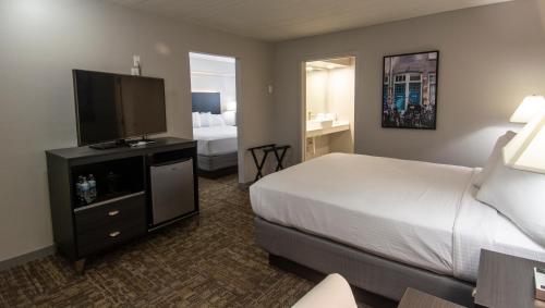 Cama o camas de una habitación en Americana Modern Hotel