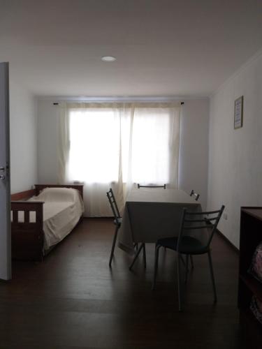 Ένα ή περισσότερα κρεβάτια σε δωμάτιο στο DEPARTAMENTOS OLIVIA