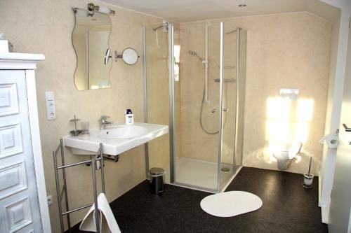 a bathroom with a shower and a sink at Ferienwohnung Dürbaum in Schleiden