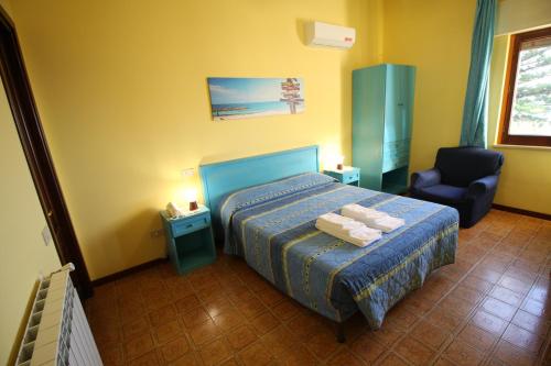 A bed or beds in a room at B&B Villa Rosa