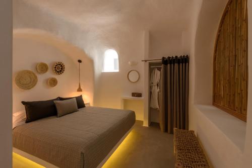 a bedroom with a bed in a room with a window at Adele Villa by Senses Collection in Pirgos