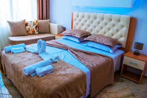 Кровать или кровати в номере Hotel Ajana
