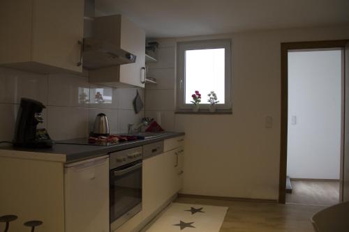 a kitchen with a sink and a stove top oven at Haase Eck in Bad Hönningen
