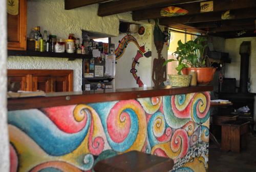a kitchen with a colorful counter top in a room at Viejo Lobo in Cabo Polonio