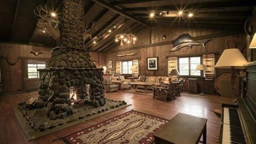 a living room with a fireplace in a house at Saguaro Lake Ranch in Fountain Hills