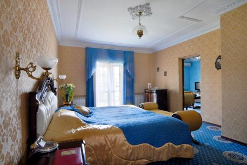 En eller flere senger på et rom på Imperator Hotel