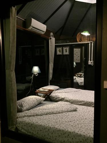 Postel nebo postele na pokoji v ubytování Jung Ja Hut