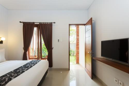 Letto o letti in una camera di Kubu Bali Suites Seminyak