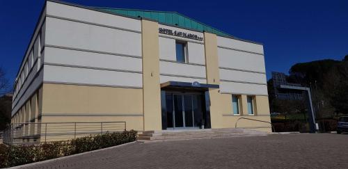 a large building with a sign on the side of it at Best Western Hotel San Marco in Siena