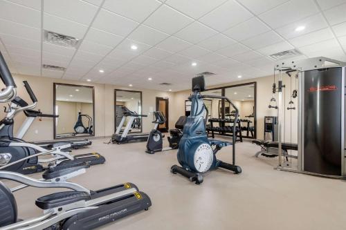 a gym with several treadmills and exercise bikes at Sleep Inn & Suites Bricktown - near Medical Center in Oklahoma City