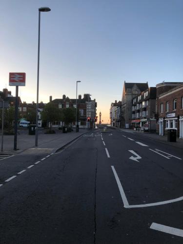 an empty street in a city with buildings at A Stones Throw to the Beach :-) in Weymouth