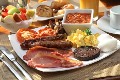 a plate of breakfast food on a table at Best Western Henbury Lodge Hotel in Bristol