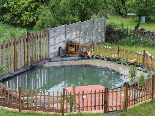 a small pool of water in a fence at Srub Losiny in Velké Losiny
