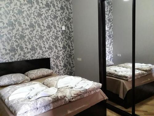 Un pat sau paturi într-o cameră la GTNL Aparthotel