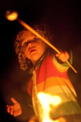 a young boy wearing a striped shirt and tie holding a stick at Liscombe Lodge Resort & Conference Center in Liscomb