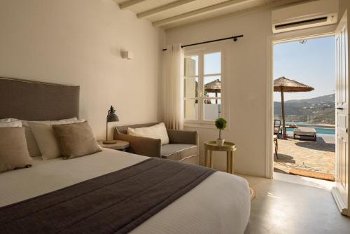 Giường trong phòng chung tại Cova Mykonos Suites