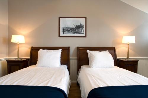Katil atau katil-katil dalam bilik di Sandhamn Seglarhotell