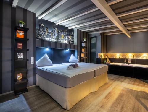 a bedroom with a large bed in a room at SL'otel - Das StadtHotel - voll Klimatisiert in Bernburg
