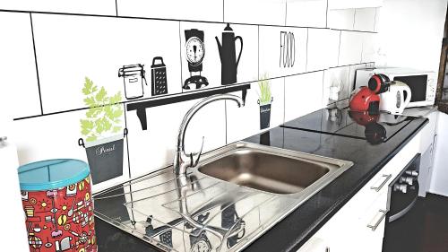 a drawing of a kitchen with a sink at Casa Miramar in Algarvia