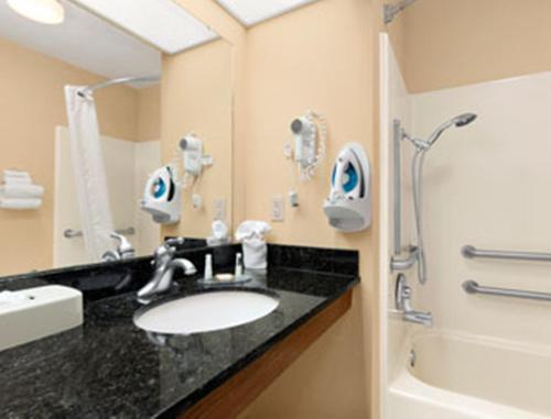 a bathroom with a sink and a shower at Baymont by Wyndham Easley/Greenville in Easley