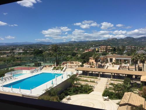a view of the pool from the balcony of a resort at Grand Hotel President in Siderno Marina