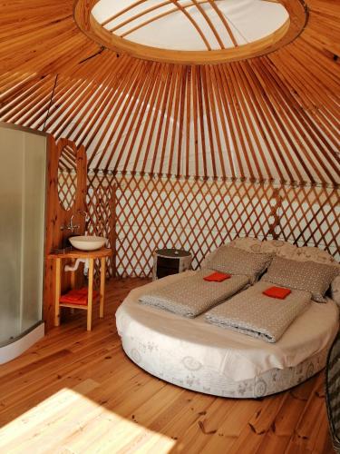 a bedroom with a bed in a yurt at Jurta Hotel Balatongyörök in Balatongyörök
