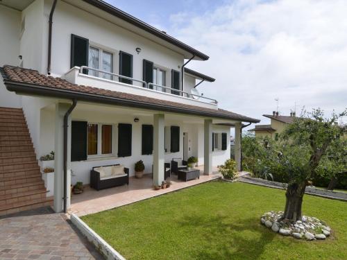 a house with a lawn in front of it at Spacious Villa with Garden in Gemmano in Gemmano