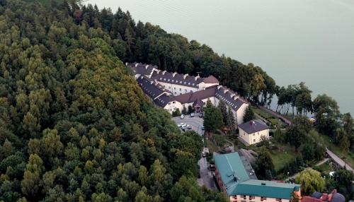 an aerial view of a village on a mountain at Hotel Mazuria Country & SPA in Mrągowo