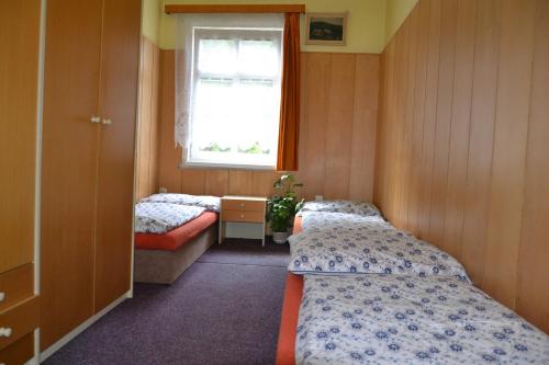 Ένα ή περισσότερα κρεβάτια σε δωμάτιο στο Hostel Fortuna