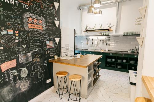 a kitchen with a counter top and a coffee maker at Prague Dream Hostel in Prague