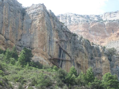 a canyon with cliffs and trees in the foreground at CASA BERNAT in Aren