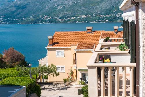 a house with a view of the water at Cina Apartments in Cavtat