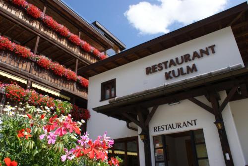 a building with a sign forrestaurantulumulumulum at Kessler's Kulm Gästehaus in Davos