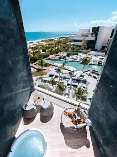 an aerial view of a resort with a swimming pool at TRS Coral Hotel - Adults Only - All Inclusive in Cancún