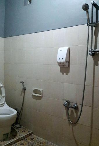 a bathroom with a shower and a toilet at relic room-Eps Comfortable for Anyone in Malang